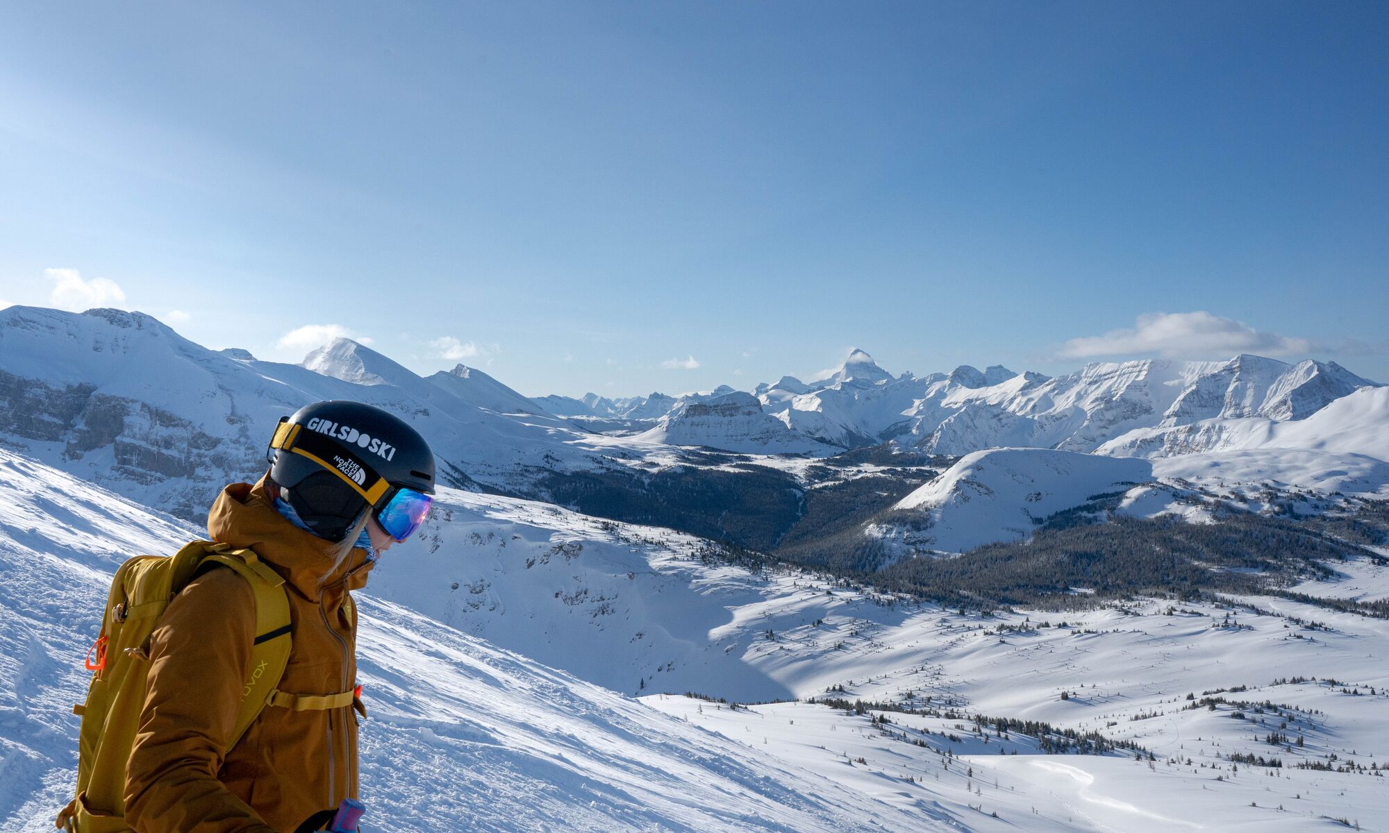 A skier looks out over the South Divide ski run at Banff Sunshine Village in Banff National Park.